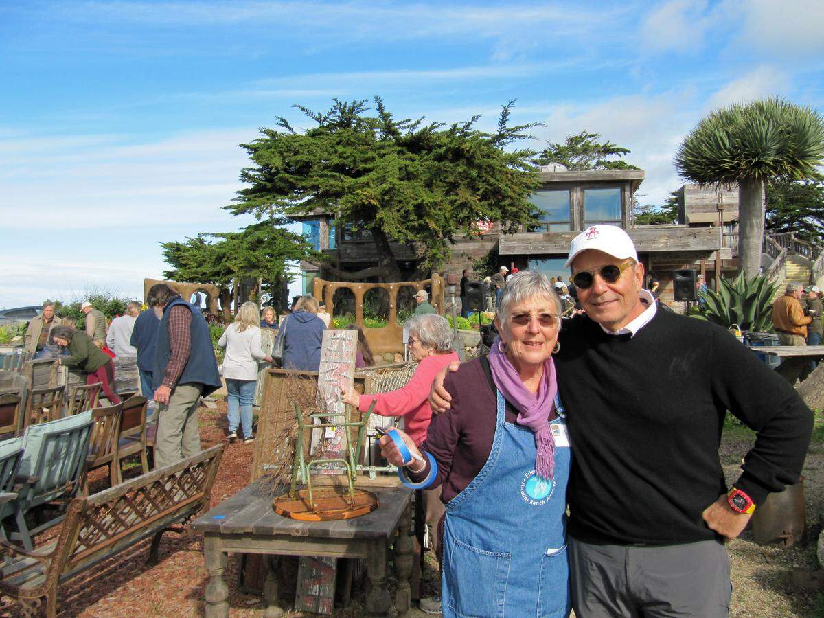 Jo Ellen Butler, executive director of Friends of the Fiscalini Ranch Preserve (left), with Georges Daou at a “treasure sale” Saturday at the future site of Daou Ocean in Cambria.