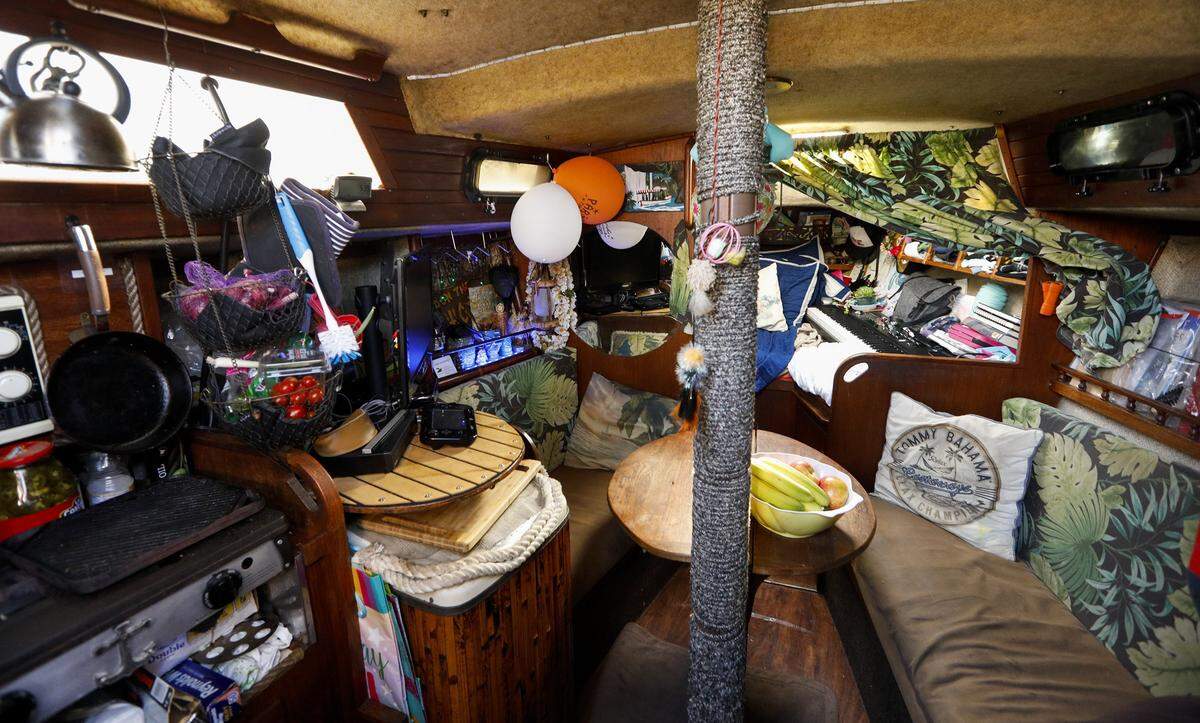 The quarters may be tight, but CC Rider, his wife and daughter have made it a cozy home living on their boat in the Port San Luis Harbor.