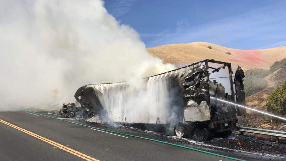Firefighters battled a 10-acre blaze that began with a semi truck and spread to the grass on Highway 41 near the border between San Luis Obispo and Kern counties on Thursday.