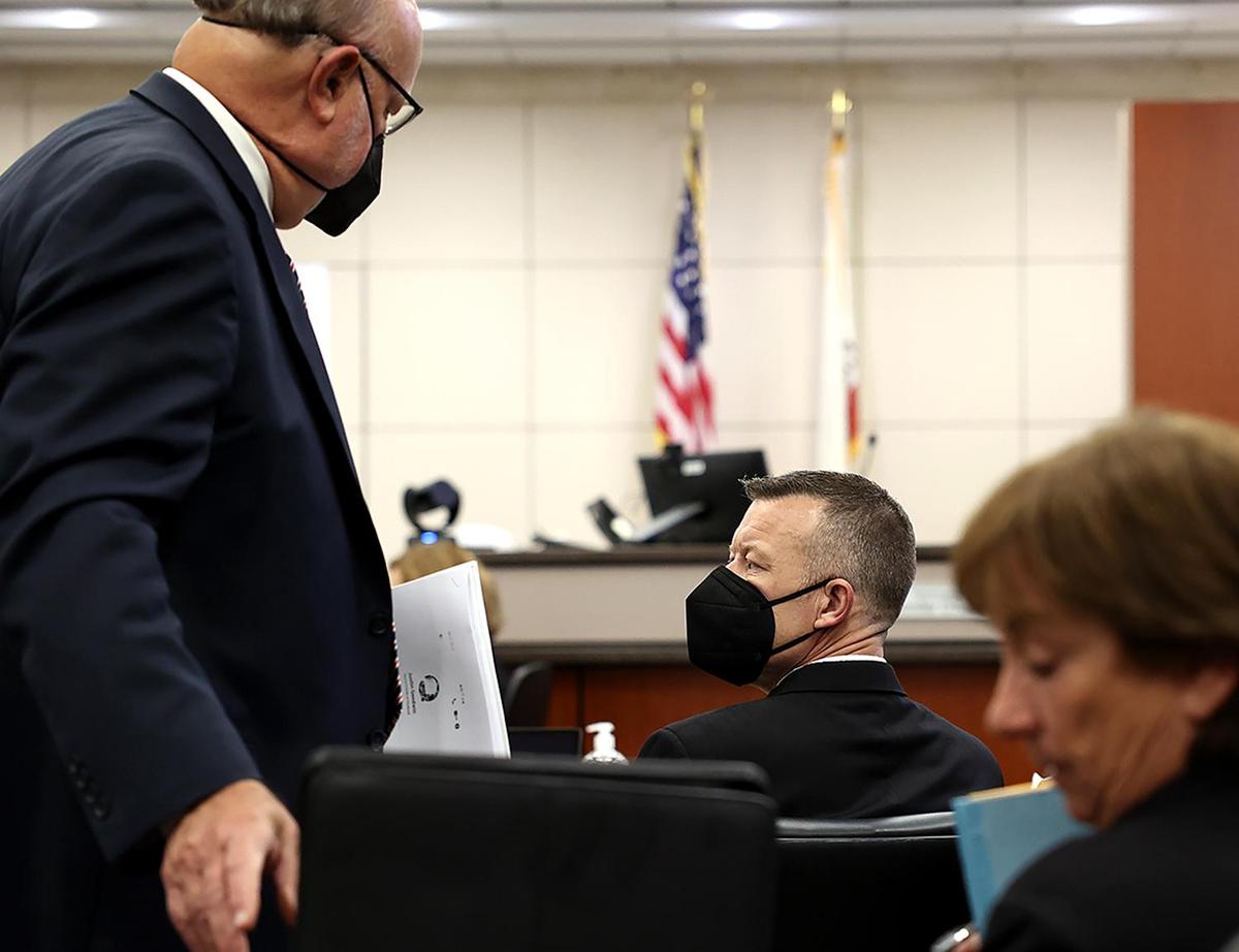 Paul Flores glances toward defense attorney Paul Sanger during the Kristin Smart murder trial in Salinas, on Monday, Sept. 12, 2022.