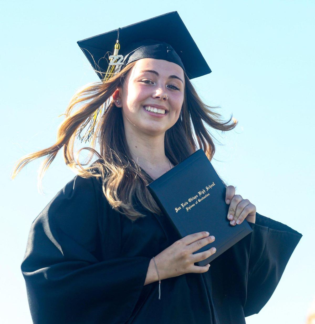Paige Beckett shows off her new diploma. San Luis Obispo High School held graduation ceremony at the football stadium June 10, 2022.
