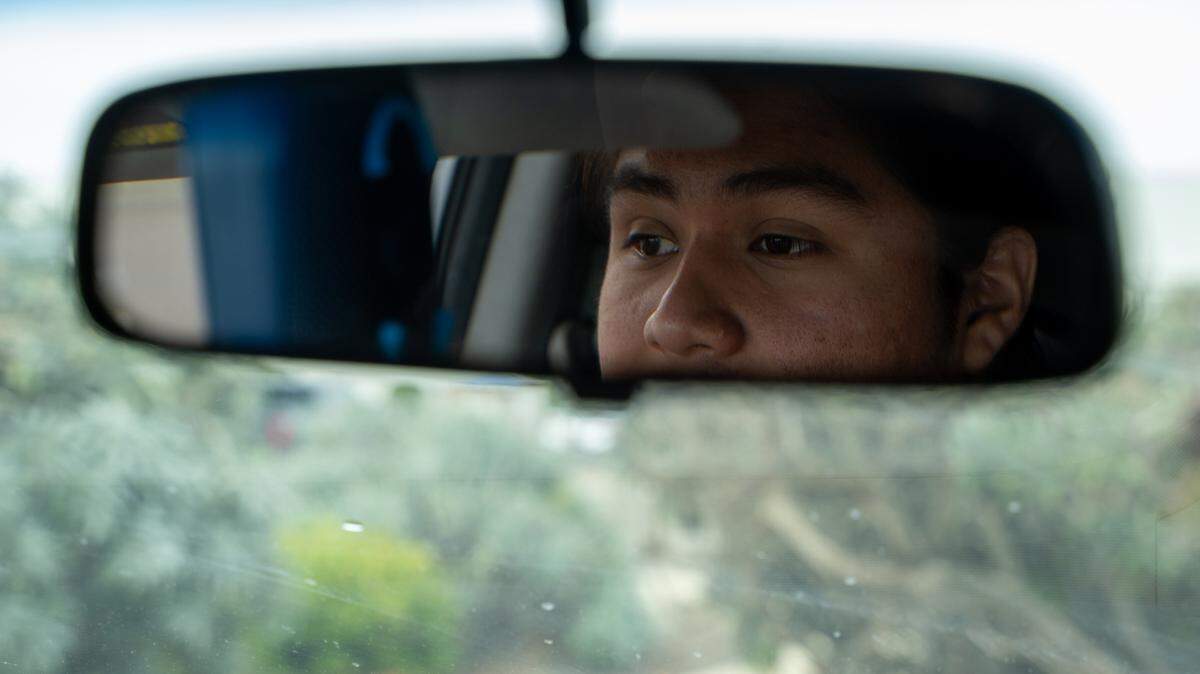 Cesar Vasquez patrols for U.S. Immigration and Customs Enforcement agents in Santa Maria on Saturday, Sept. 20, 2025.