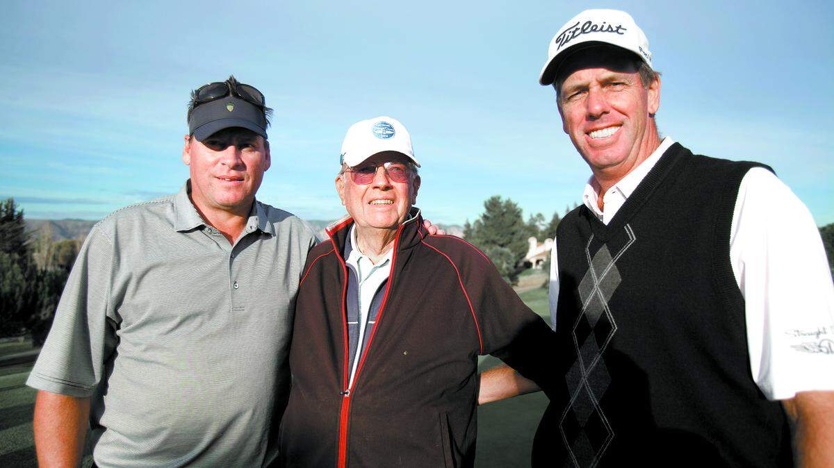 Tournament champions Doug Garwood (right) and Joe Bendetti (left) pose with Garwoodâ™s mentor Lloyd Anderson after the duo made its final putt at the 18th annual Straight Down Fall Classic at the San Luis Obispo Country Club on Sunday.  

Photo by Laura Dickinson 11-16-14