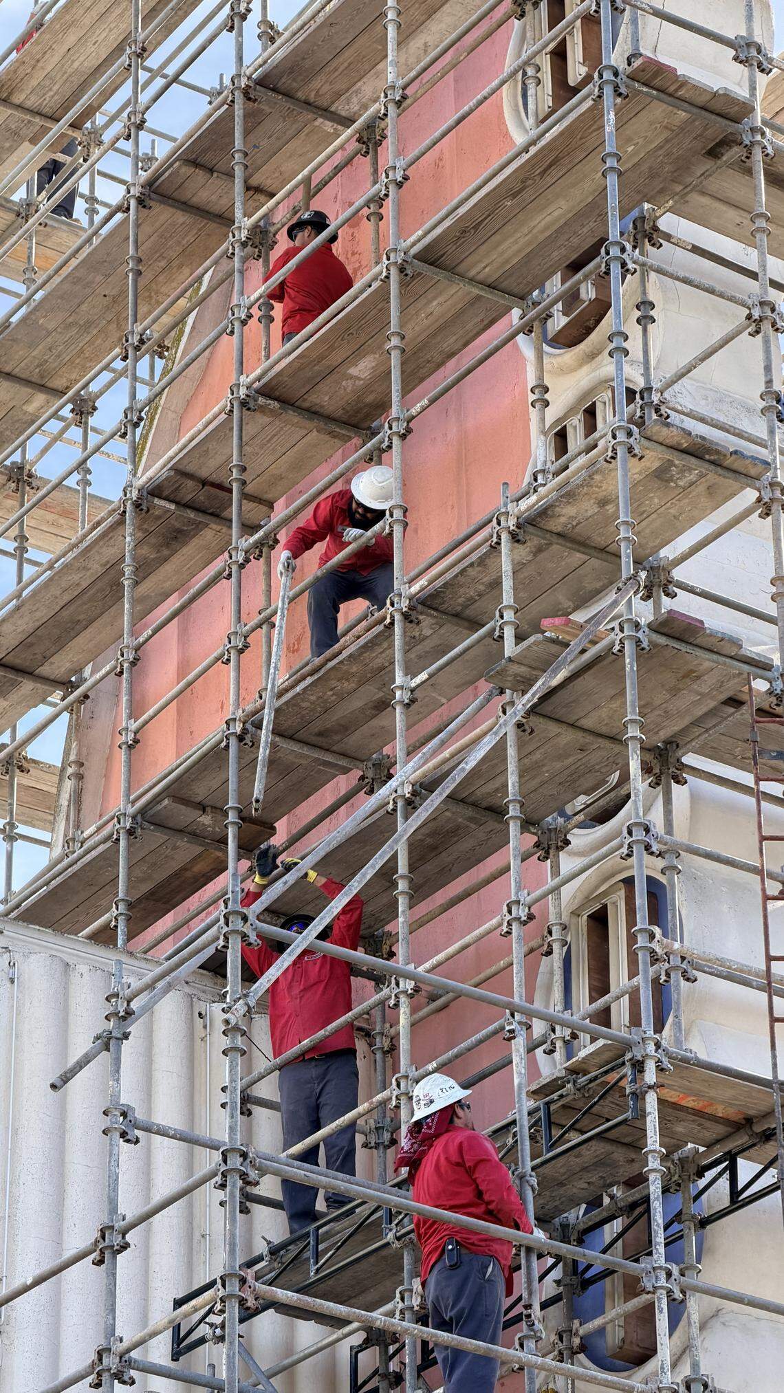 Workers set up scaffolding around the damaged Fremont Theater sign on Wednesday Feb. 25, 2026, in downtown San Luis Obispo.
