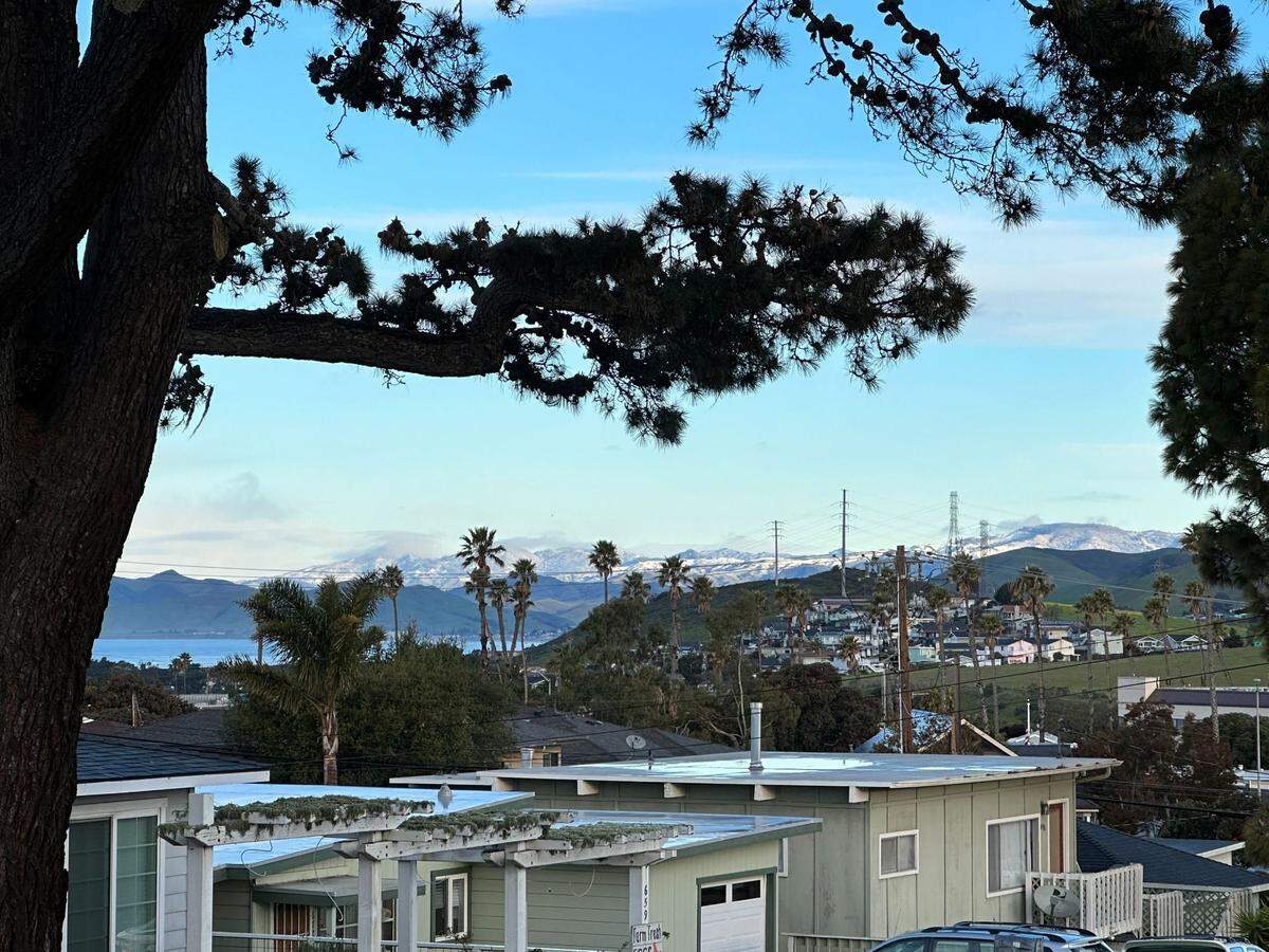 Snow is seen in the mountains above Morro Bay on Thursday, Feb. 23, 2023.