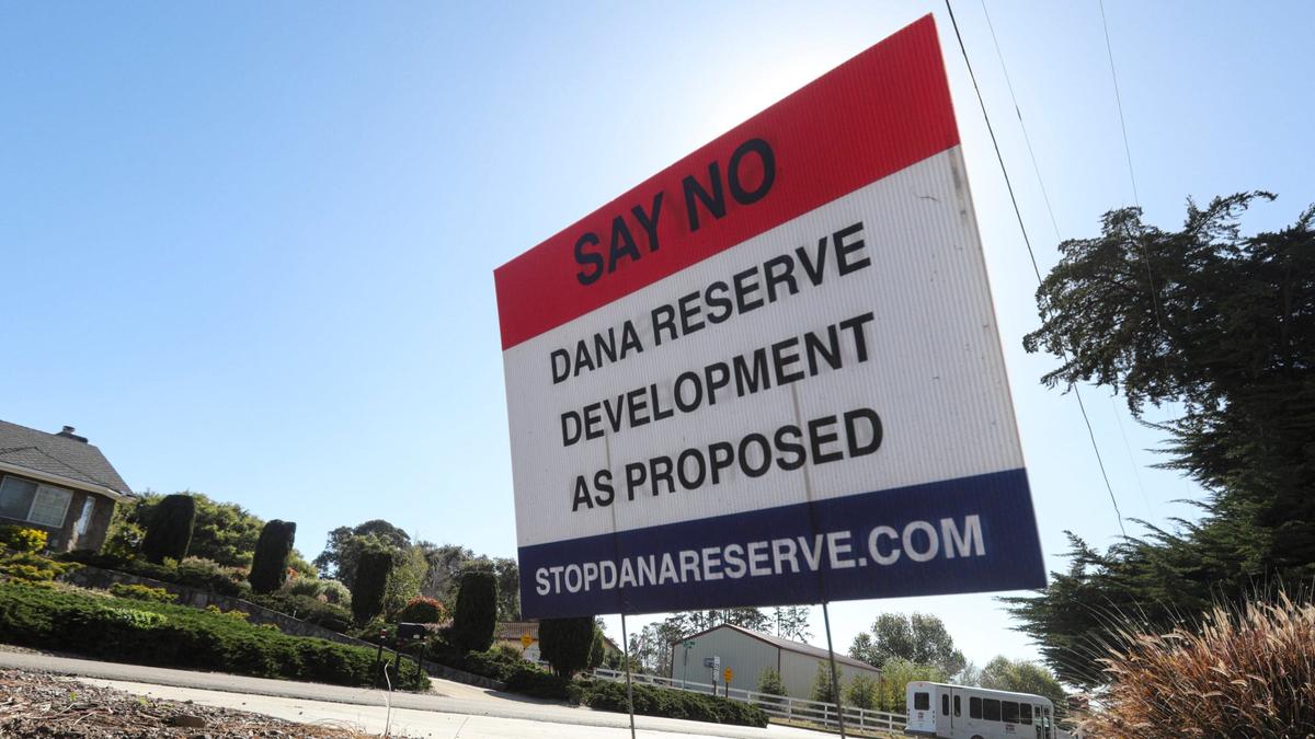 Signs opposing the development are on streets next to the proposed Dana Reserve on April 1, 2024.