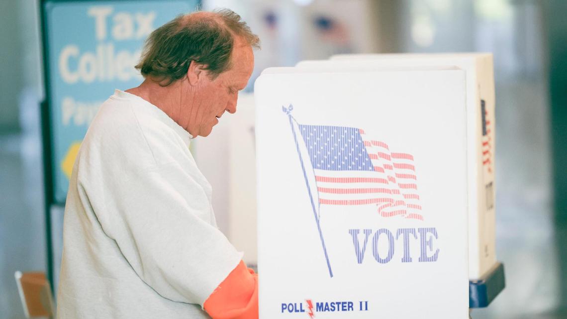 Tracy Nelson fills out his ballot at a voting station in the lobby in front of the elections office. Ballots were being collected at the San Luis Obispo Clerk-Recorder’s office at the Katcho Achadjian Government Center during the Super Tuesday election on March 5, 2024.