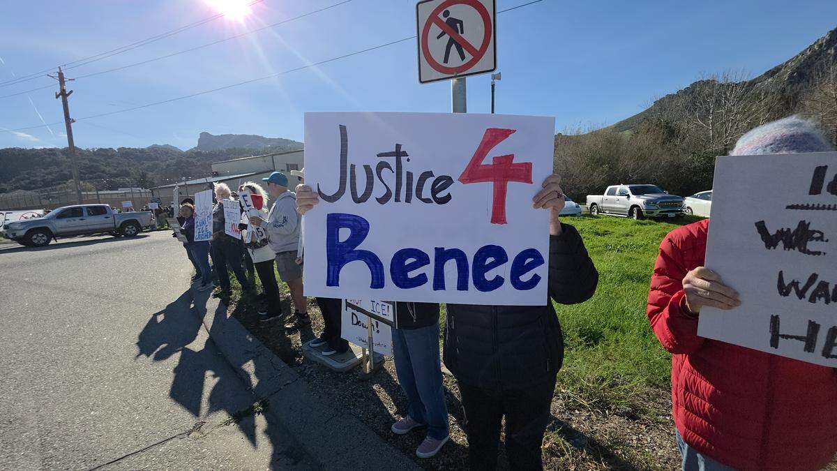 More than 250 people gathered at Highway 1 and Kansas Avenue to protest ICE in San Luis Obispo on Jan. 11, 2026.