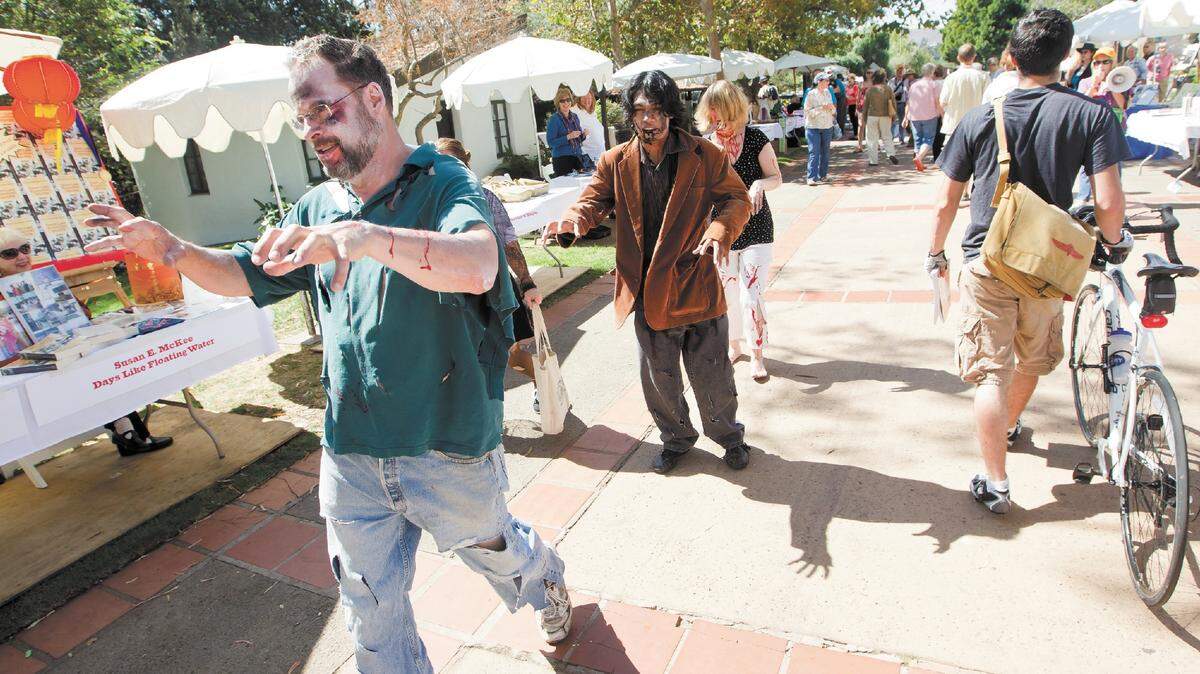 A zombie parade at Mission Plaza on Sunday welcomed author Jonathan Maberry to the Central Coast Book and Author Festival. A horror professional, Maberry has spun stories featuring zombies, vampires and werewolves. Readers covered in fake blood showed up to support him. Zombie etiquette was mandatory.