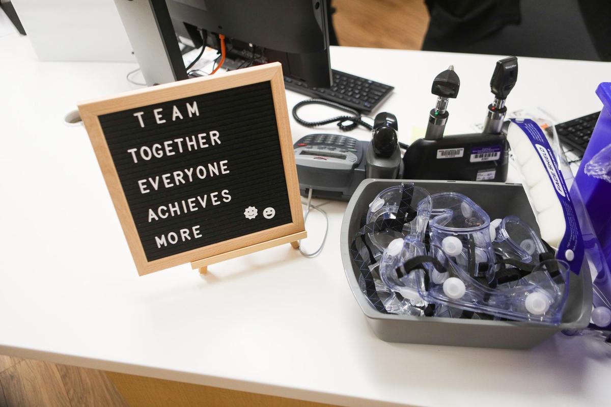 Amid the summer surge of new COVID-19 patients, a sign at a nurse’s station encourages staff at Sierra Vista Regional Medical Center. Beside it are supplies of personal protective equipment at Sierra Vista Hospital.