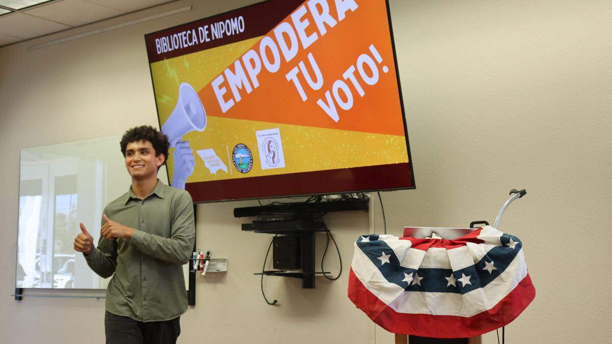 Cal Poly student Darius Rogness leads a voter information and empowerment workshop for Spanish-speakers at the Nipomo library on Sept. 11, 2024.