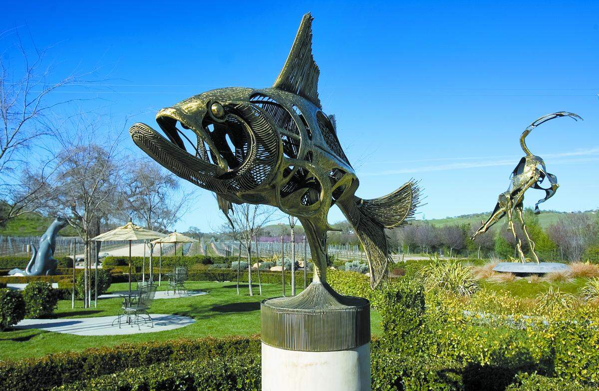 John Jagger’s ‘Tarpon Fish’ was created from a base of bronze wires with dripped bronze used to fill in the spaces. Above right, ‘Yahoo,’ a bucking bronco, leaps high above the umbrellas of the viewing nooks.