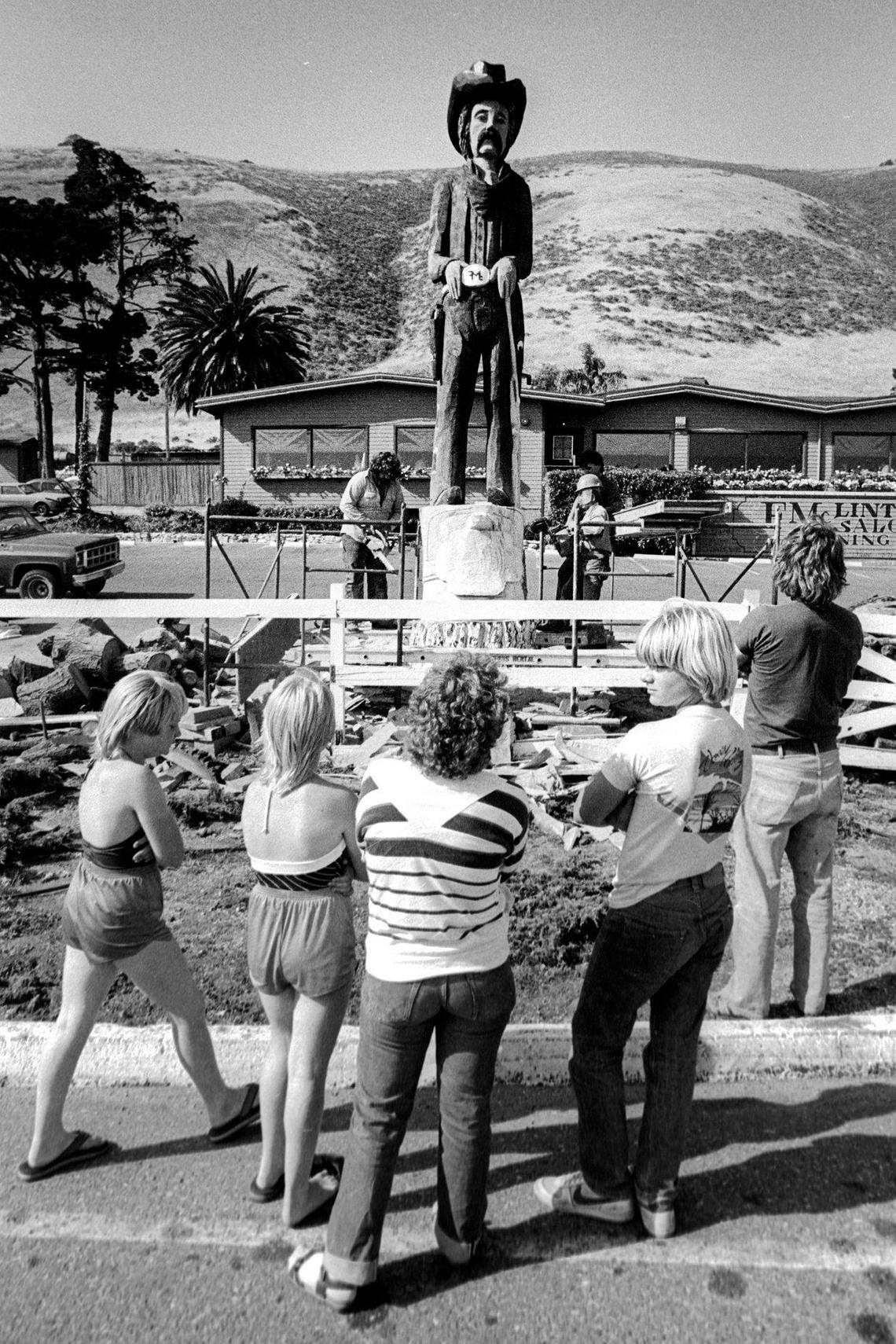 A crowd of admirers gathers to look at Clint the cowboy, the new landmark in the parking lot of McLintocks Saloon and Dining House in Pismo Beach in June 1983.