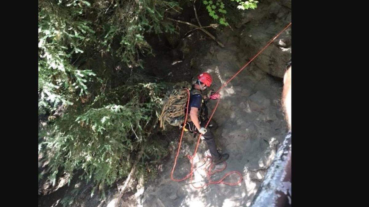 A first responder looks for Brian Lewinstein, a 23-year-old law student at UC Berkeley. Lewinstein has been missing since Sunday, when he crossed a safety fence to take a photo and tumbled down an embankment.