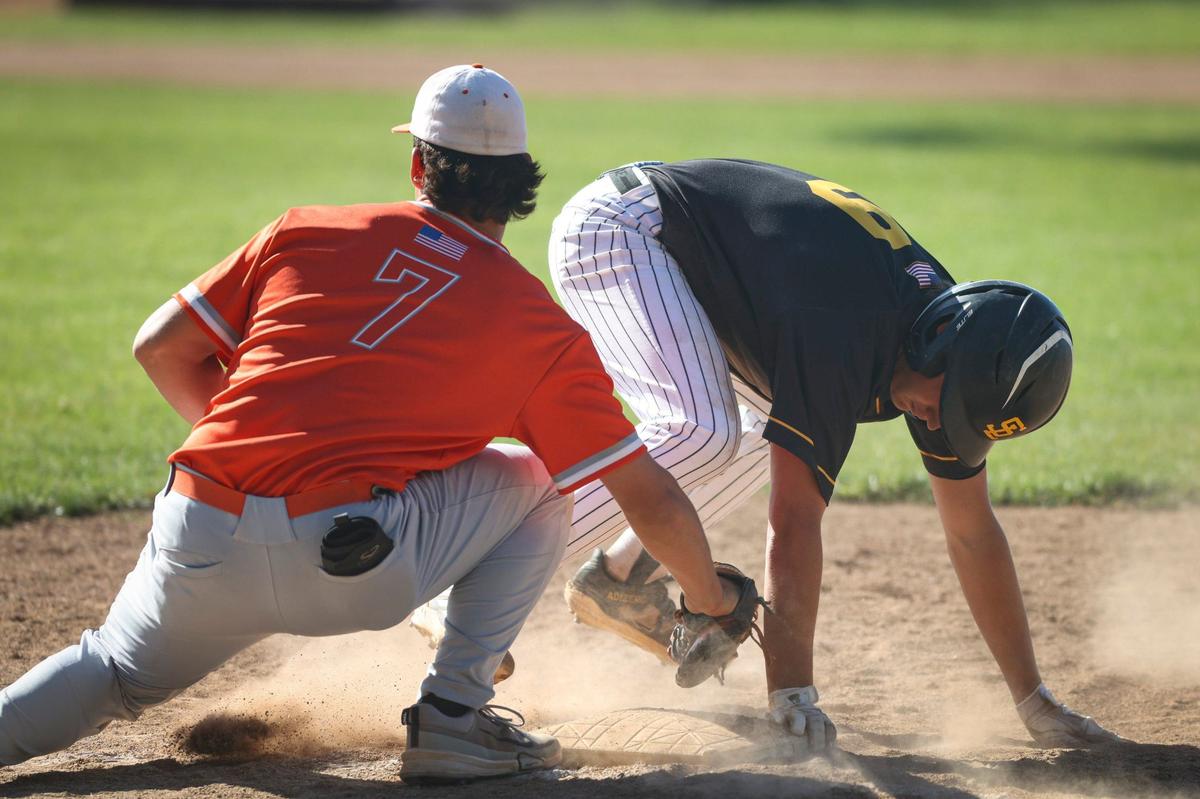 Hayden Hall gets back ahead of a pickoff attempt as Chase Viale applies tag. Atascadero won 8-3 over San Luis Obispo in a baseball game May 3, 2024.