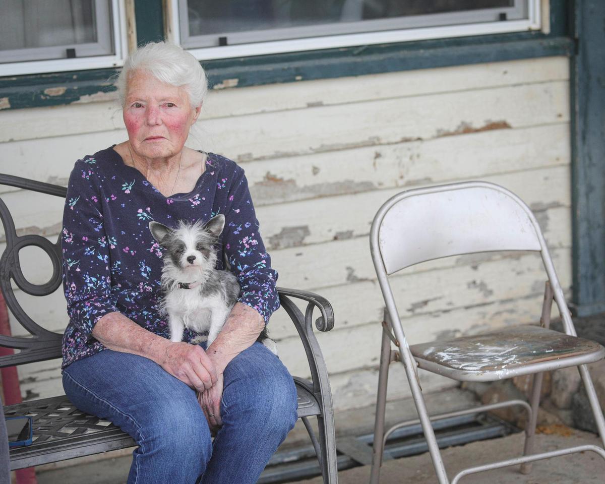 Since the 1990s, Candy Nachel has lived on her property east of Templeton. All three of her wells went dry, and she spends about $350 per month to truck in water. Nachel is seen here with her dog Poppy on Feb. 27, 2025.