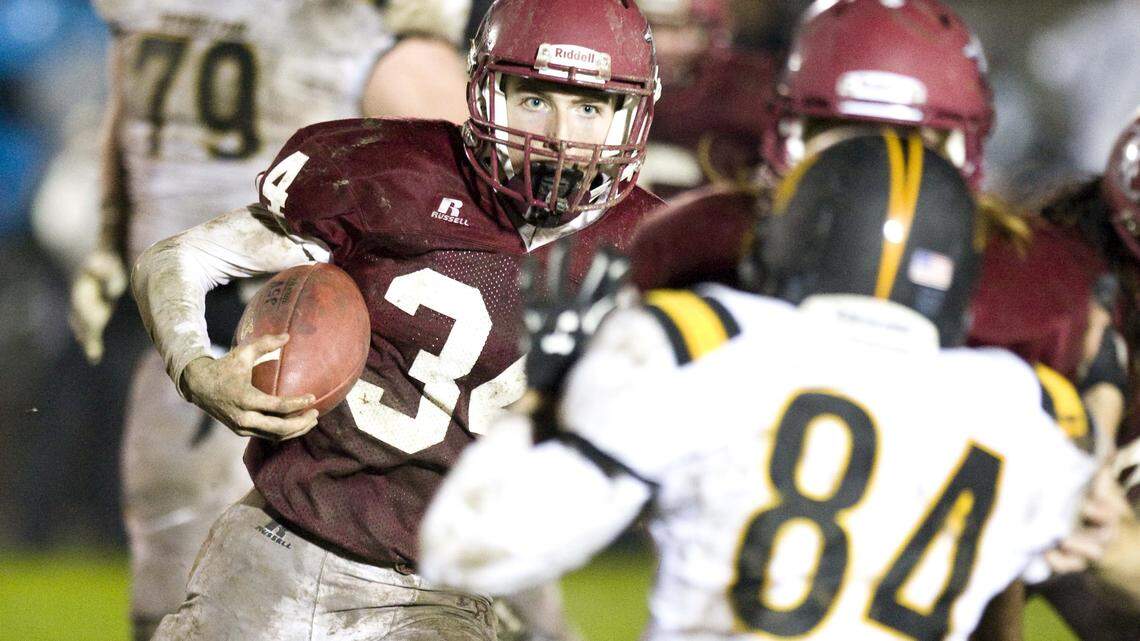 Paso Robles running back Bailey Gaither (34) finds room to run in the Bearcats’ title game victory Friday. Gaither had 206 yards rushing on 28 carries.