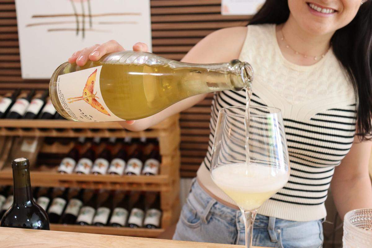 Marin Wolgamott, the owner of Marin’s Vineyard, pouring a glass of the label’s signature sparkling viognier in the winery’s new downtown Atascadero tasting room, which opened at 5983 Entrada Ave. in August 2024.