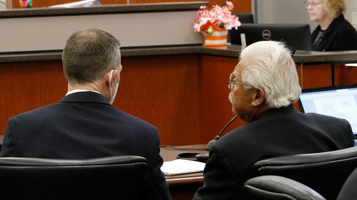 Paul Flores, left, and Ruben Flores talk in Monterey County Superior Court before court proceedings start in the Kristin Smart murder trial on Thursday, Aug. 4, 2022.