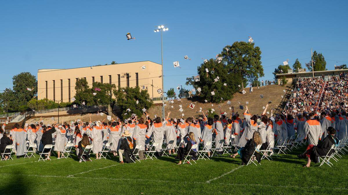 Atascadero High School students toss their graduation caps into the air at the end of commencement ceremonies on Wednesday, June 3, 2026. 296 seniors walked the stage and received their diplomas.