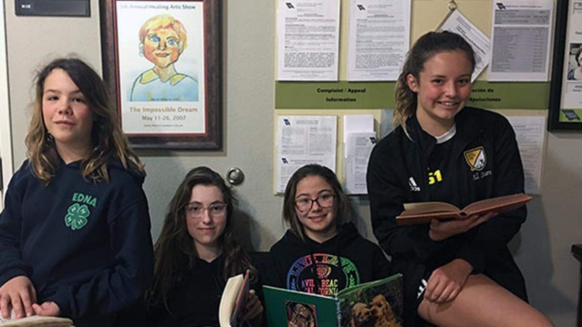 Local Girl Scouts (from left) Aggie Moody, Katie Geise, Katya Harris and Tess Bolster are collecting books for underserved young people in San Luis Obispo County during March.