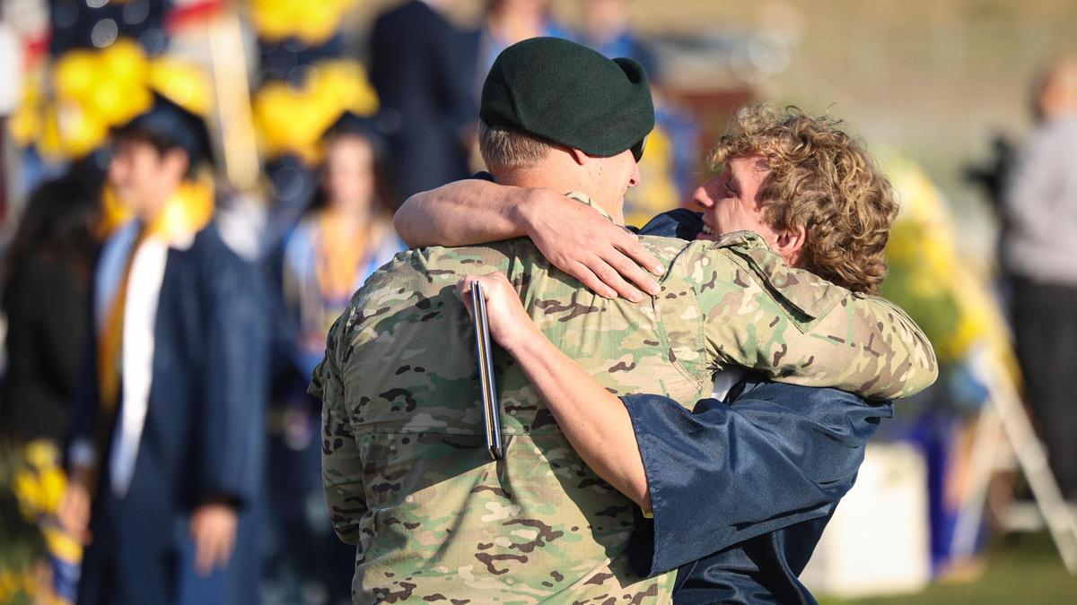 Graduate Max Tuggle gets a surprise hug from brother Theo, who got an unexpected leave from the U.S. Army to attend graduation. Arroyo Grande High School held commencement for 520 graduates on June 5, 2025.