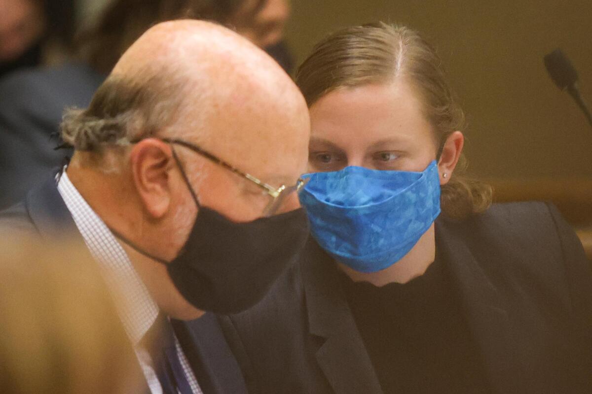 Defense attorneys Robert Sanger, left, and Sara Sanger consult in San Luis Obispo Superior Court on Tuesday, Aug. 3, 2021, during a preliminary hearing for Paul and Ruben Flores. The attorneys represent Paul Flores, who is accused of murdering Cal Poly student Kristin Smart.