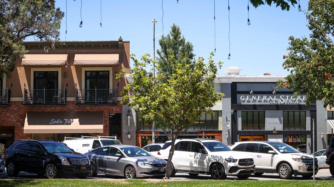 Lights hang from oak trees and signs for paid parking have been removed from downtown Paso Robles near 12th street at City Park on June 17, 2024.