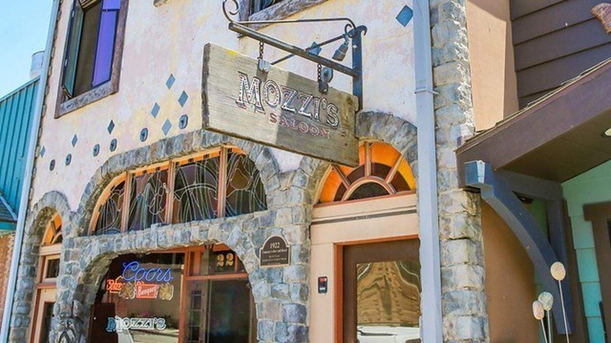 The Old Camozzi’s Saloon building, a circa 1922 downtown structure that has for decades housed the town’s last remaining “cowboy bar” and six small upstairs apartments in Cambria, is for sale.