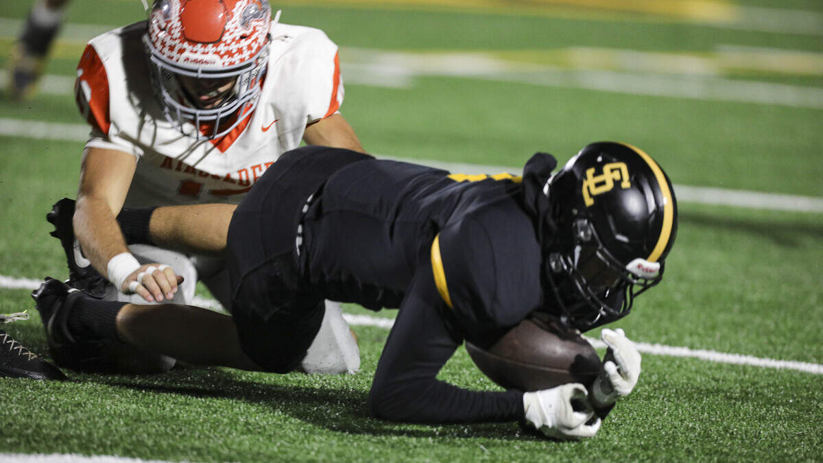 Sutter Stornetta recovers a fumbled punt setting up a short field for the Tigers. San Luis Obispo beat Atascadero 38-14 on Sept. 11, 2026.