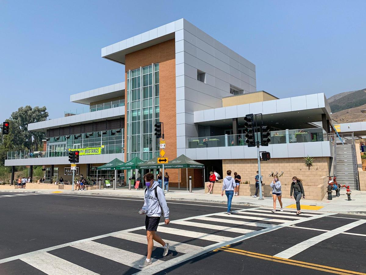 Masked students walk outside Cal Poly’s new Vista Grande Dining Complex, which opened in time for fall quarter. Thousands of students arrived on campus Monday for the first day of fall quarter in-person classes.
