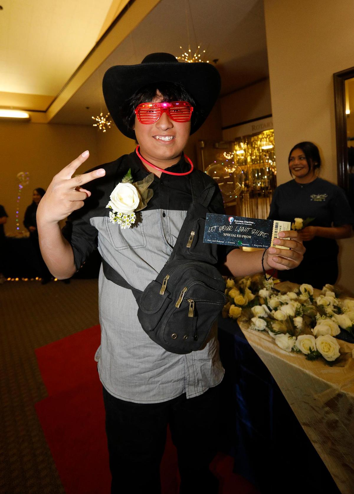 Ricardo Arroyo shows off his boutonniere and cowboy hat at the “Let Your Light Shine” Special Education Prom in Atascadero on Friday, March 7, 2025. This special education event aims to provide a night of fun, joy, and celebration for individuals with disabilities, giving them the opportunity to enjoy the prom experience in an accessible and supportive environment.