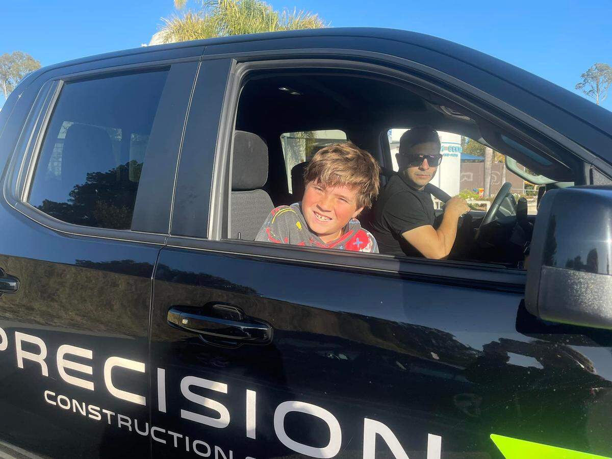 Jason Erracalde and his son, Jaxon, at Precision Construction Services.