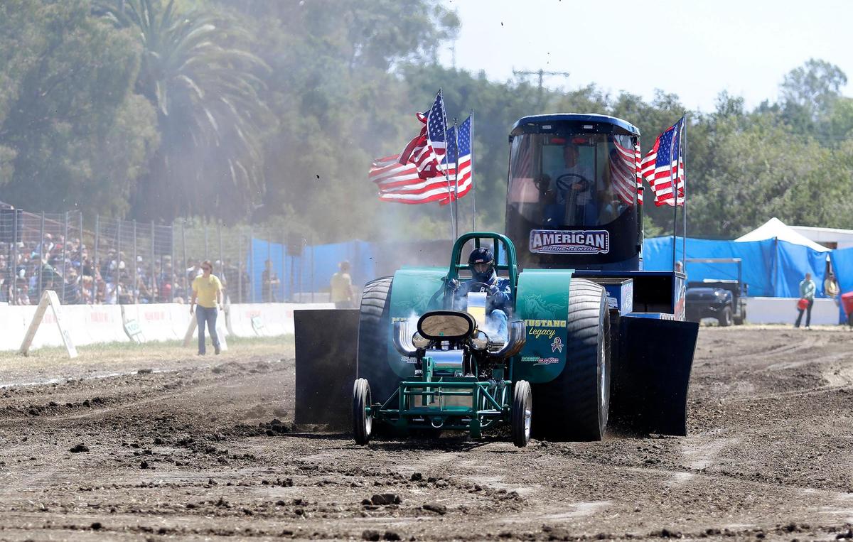 Cal Poly tractor club member Theron Dale competes in the tractor pull during the 29th annual Cal Poly Open House on Saturday, April 9, 2022, which showcases campus programs to new students, families and the community. 