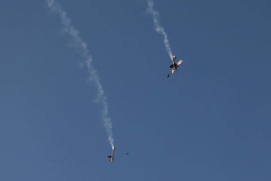 Pilots Luke Aikins and Andy Farrington exit their planes in an attempt to swap them and land both safely during a stunt in Eloy, Arizona, on April 24, 2022. One of the pilots completed the swap and landed the plane safely while the other was unable to do so and parachuted to the ground.