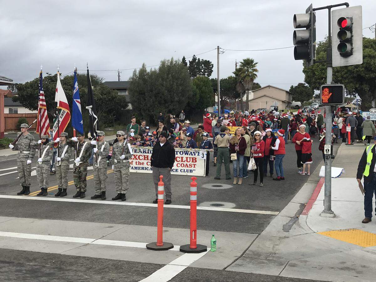 A color guard leads the start of the South County Holiday Parade.