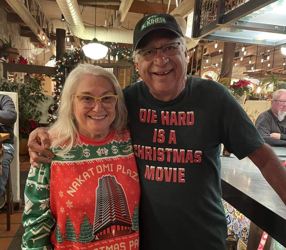 Sherry Scott found a kindred spirit in Geno Flores when they spotted one another’s attire at a restaurant and bonded over their conviction that “Die Hard” is very much a Christmas movie.