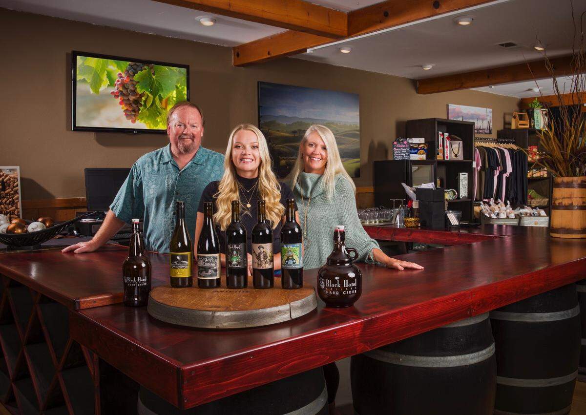 Tom, Cassidie and Terrie Banish showcase the wine and spirits of Black Hand Cellars.