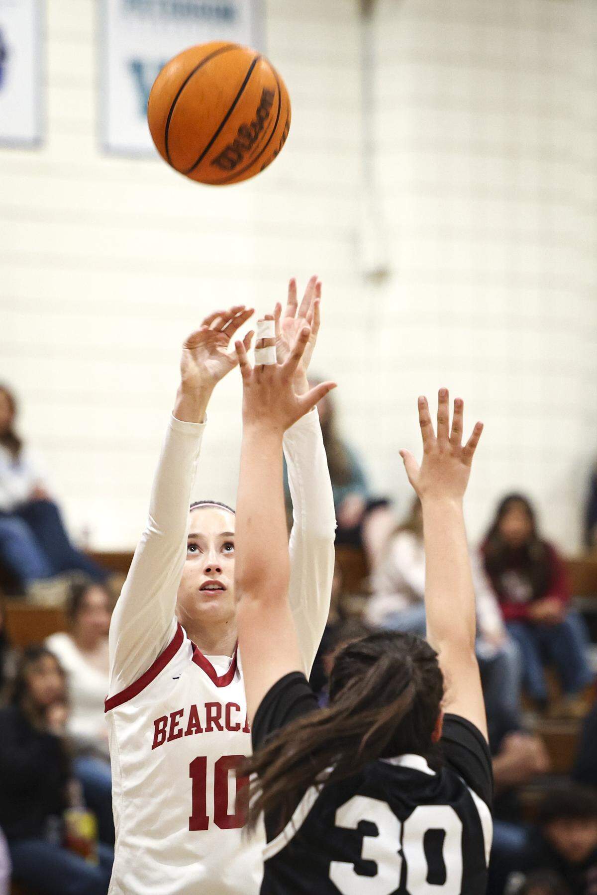 Tori Holbrook shoots over Juliana Able. Paso Robles High School girls's basketball team beat Nipomo 57-36 on Feb. 6, 2026.