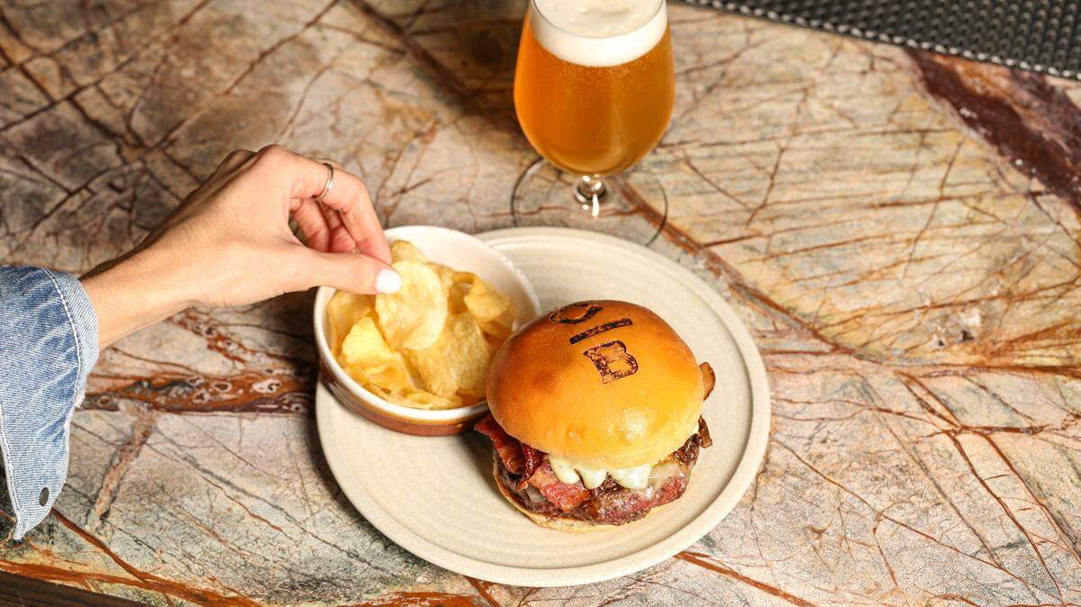 The stockman burger at Cattlemen’s Bar includes dry aged beef, bacon and caramelized onions.