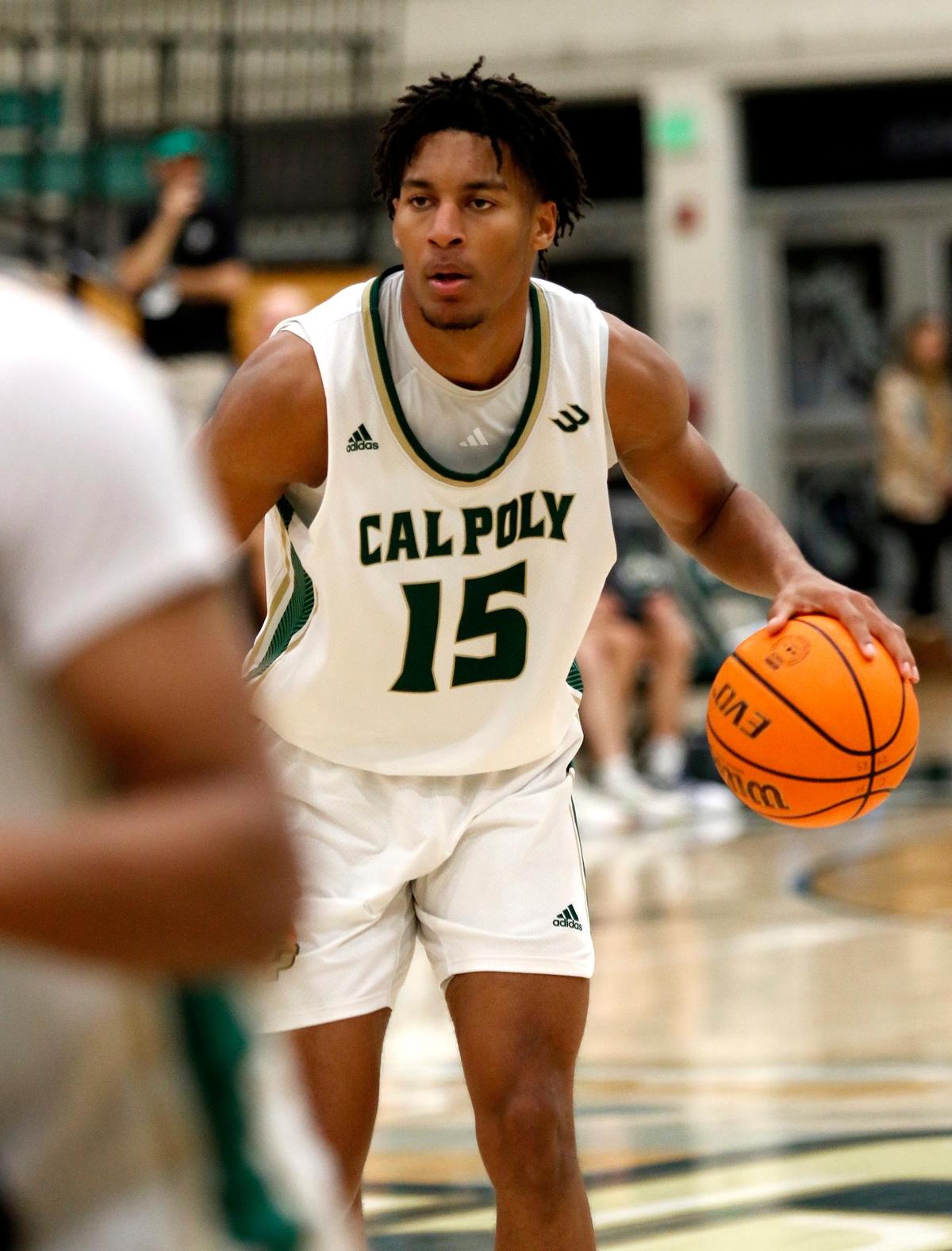 Aaron Price Jr. gets ready to pass the ball. Cal Poly beat Hawaii 79-63 in a men’s basketball game at Mott Athletic Center in San Luis Obispo on Thursday, Feb. 6, 2025.