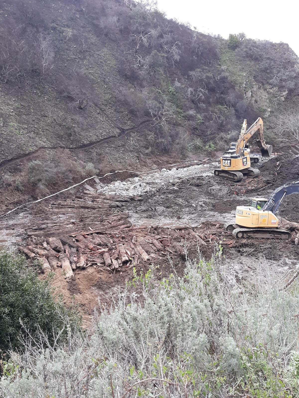 Earth-moving equipment scrapes and relocates soggy soil, rocks and more Feb. 11.