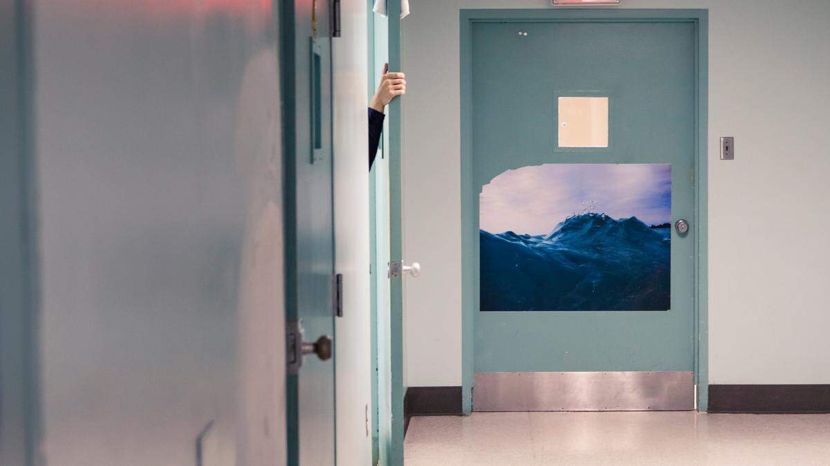 A patient closes their door in the 16-bed adult wing of Psychiatric Health Facility in San Luis Obispo. The grand jury called the facility “antiquated and unsafe.”