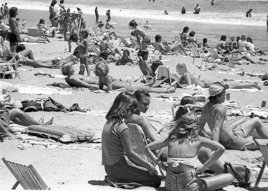Sun worshipers enjoy sitting out at Avila Beach on June 28, 1976.