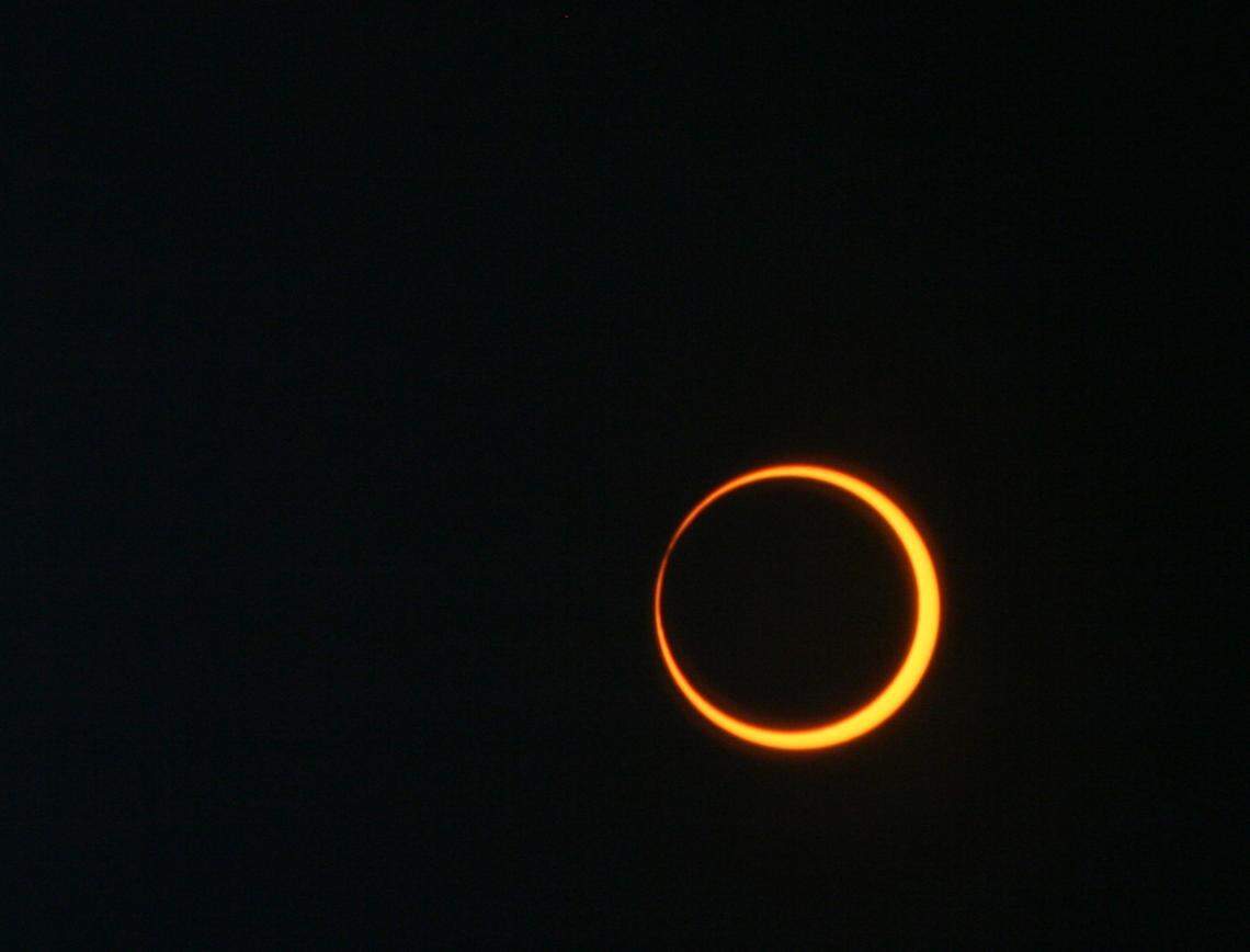 An annular solar eclipse happens when the Moon passes between the Sun and Earth while it is at its farthest point from Earth. Because the Moon is farther away from Earth, it appears smaller than the Sun and does not completely cover the star. This creates a “ring of fire” effect in the sky.