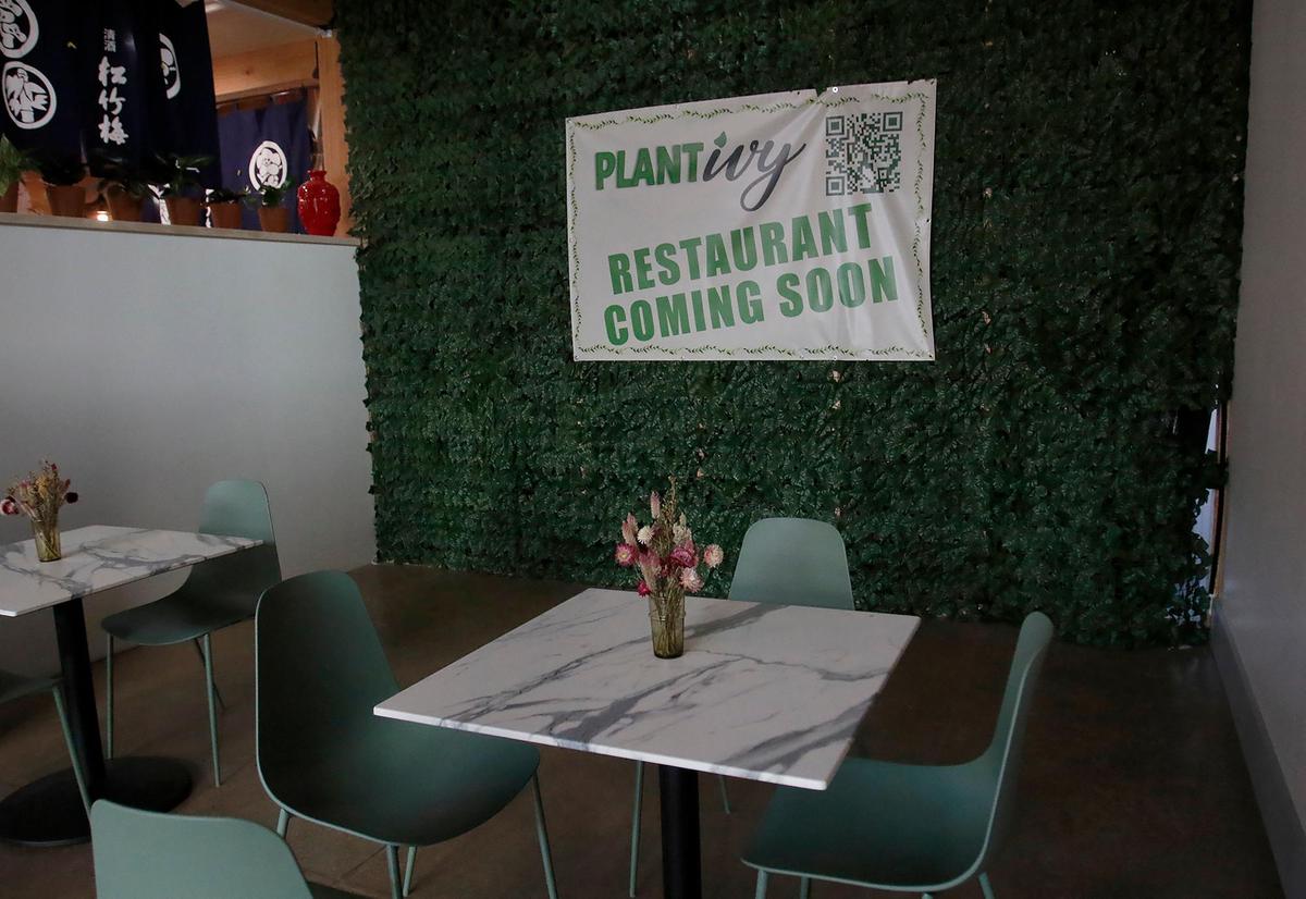 SLO Ranch Farms has six new business opening soon. Plant Ivy Restaurant signs say “coming soon.”