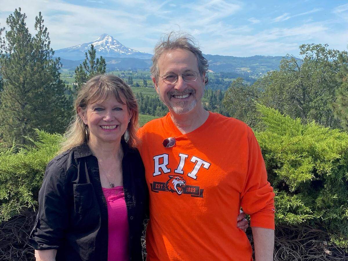 Teresa and Leigh Rubin pose for a picture near Mt. Hood, where the two were married in 1985 and renewed their vows in 2021.