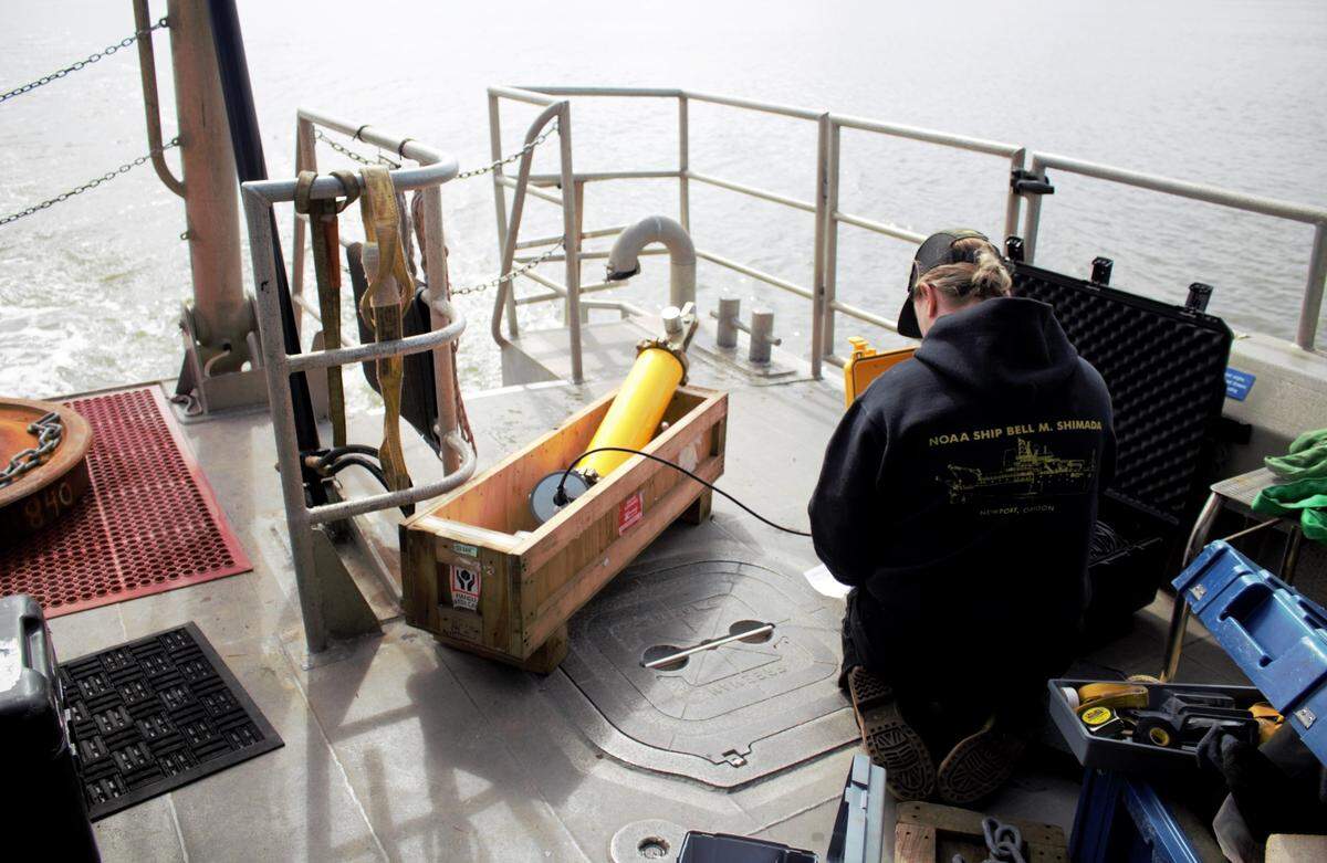 NOAA scientist Lauren Roche puts the finishing touches of her sound recording equipment that was deployed into the Pacific Ocean in the proposed Chumash Heritage National Marine Sanctuary on March 12, 2023.