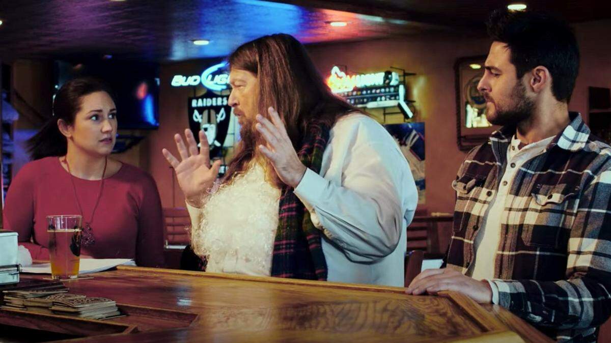 Santa (Rick Bruce), center, as Santa, advises Noël (Libby G. Parker) and Jake (Michael Estridge) in a scene from the new movie “Christmas Couple: Unwrapped.” Bruce, known locally as a magician and actor, is the father of the film’s screenwriter, Jackson Bruce. The 40-minute movie, a TFT Films production, debuted on YouTube on Dec. 18.