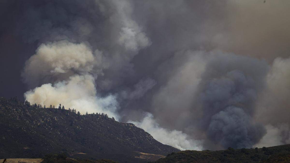 Smoke rises from the Gifford Fire burning from the Los Padres National Forest toward an area under an evacuation order behind Lopez Lake, seen here from Hi Mountain Road on Aug. 7, 2025.